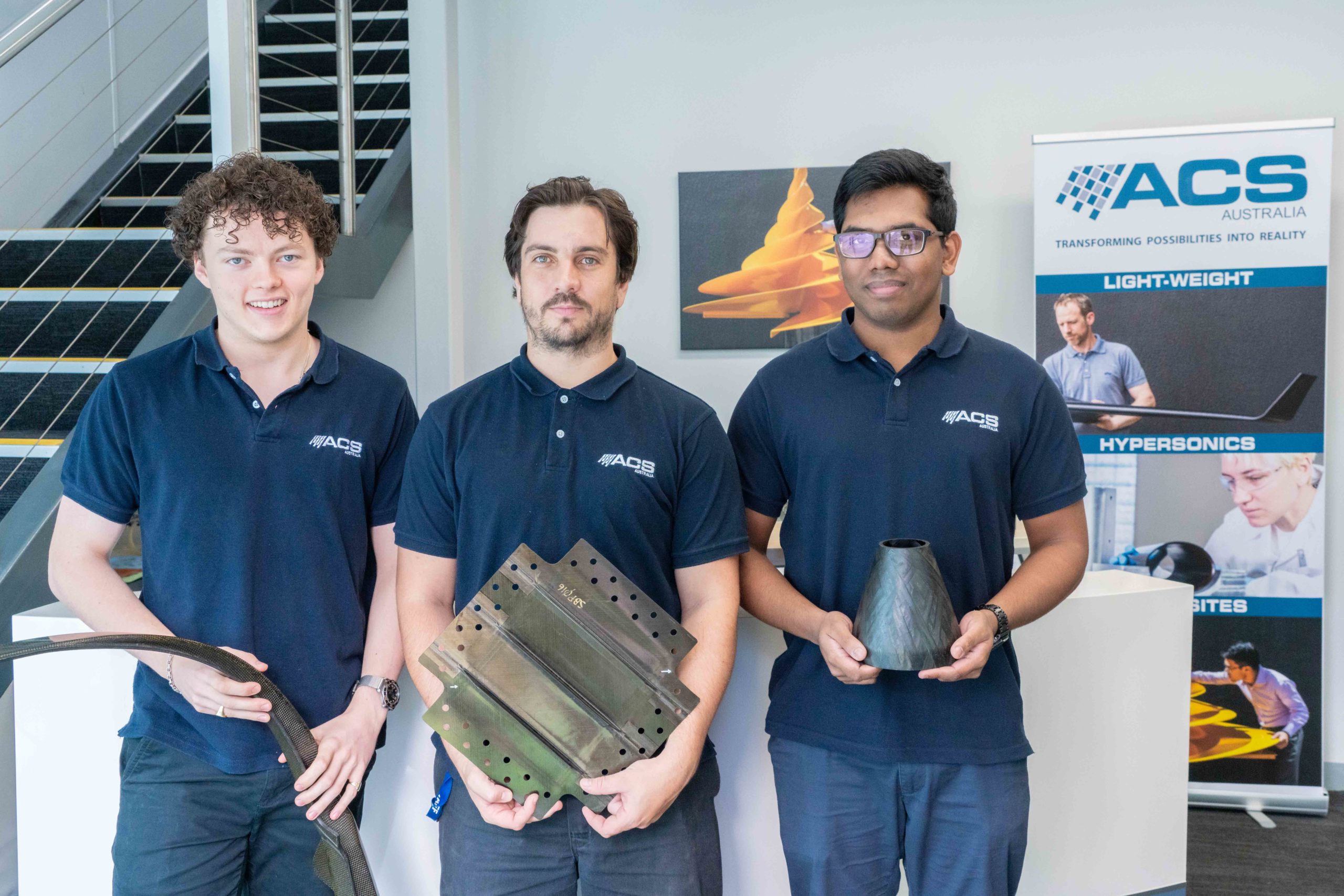 (L-R) Group photo of Defence Industry Internship Program (DIIP) Interns Kai Farrer, Nic Rayner and Shevaan Leitan at Advanced Composite Structures Australia (ACS-A)