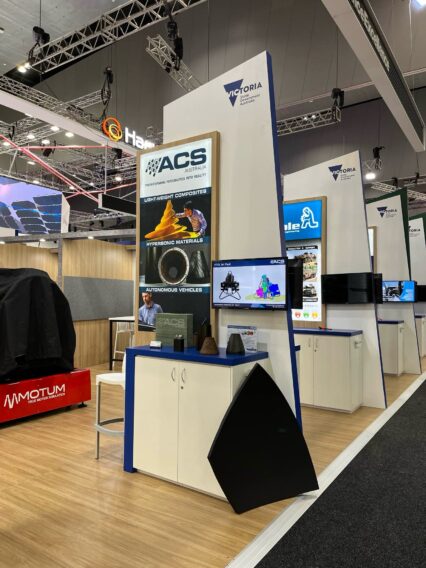 Advanced Composite Structures Australia | ACS-A stand at the Victoria Stand with demonstrators, including carbon fibre SatCom dish section.​