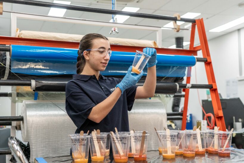 Alexandra Margiolis DIIP Intern Inspecting Resin Samples at ACS Australia